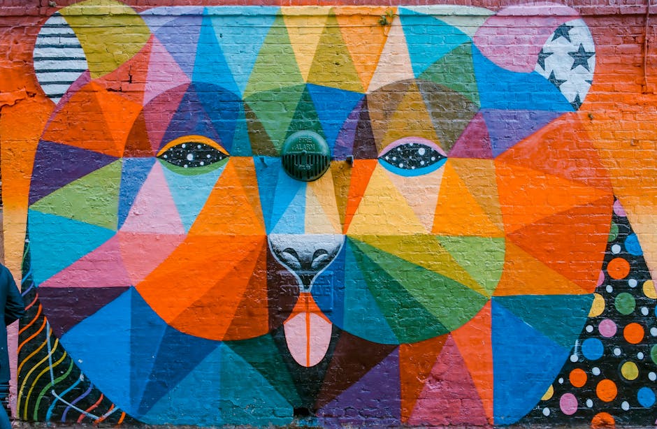 Colorful geometric street art mural on brick wall
