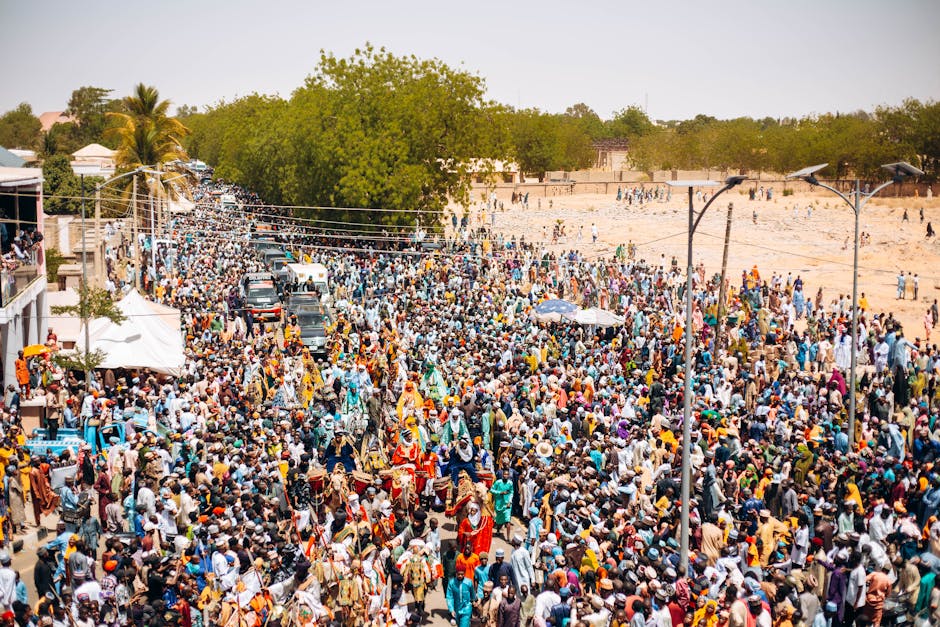 Cultural street festival with crowd in colorful costumes
