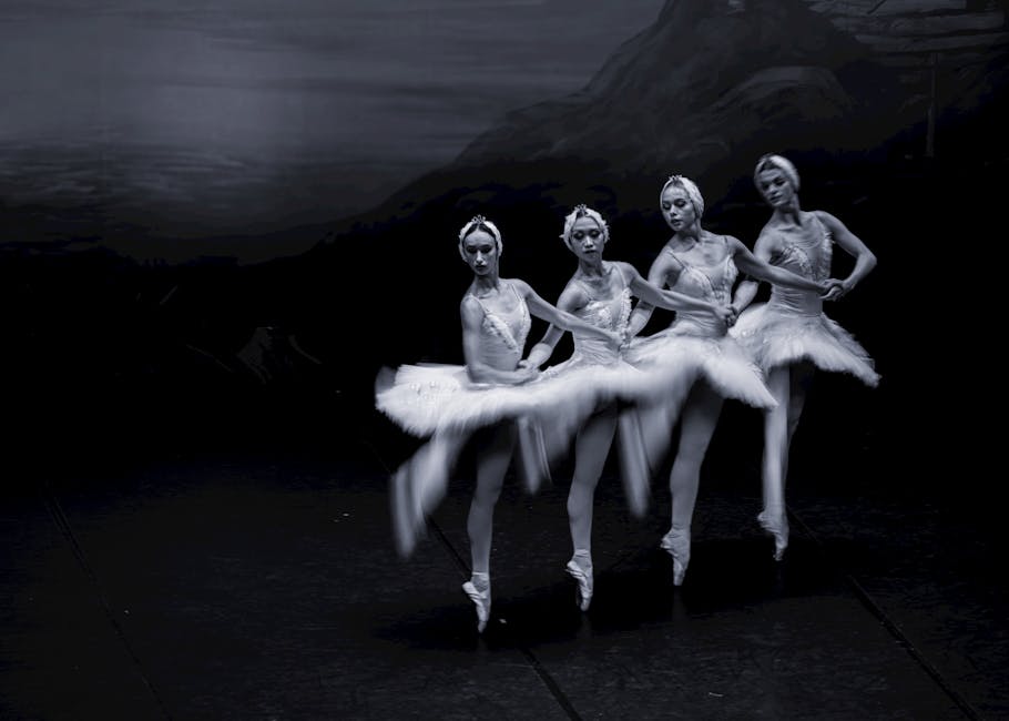 Ballet dancers performing Swan Lake on stage