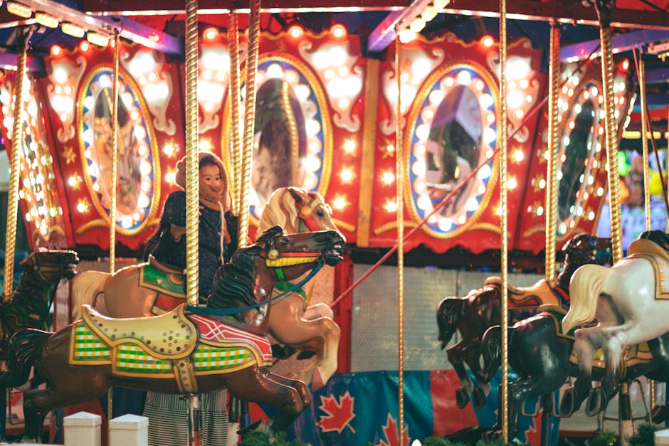 Joyful carousel ride with children at an amusement park at night