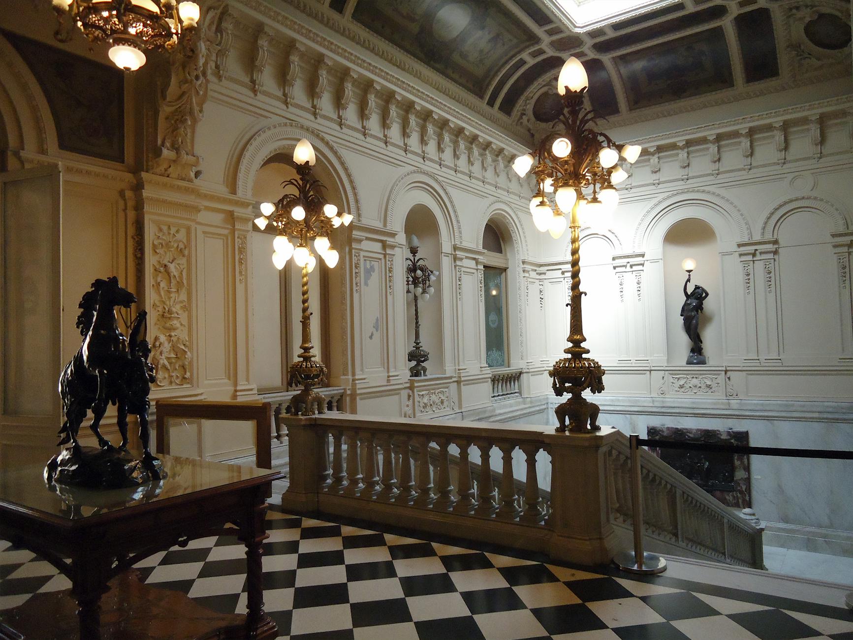 Casa Loma interior Great Hall with stone columns and stained glass