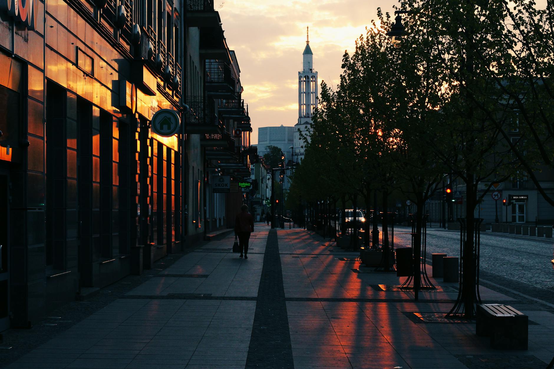 City street at night with glowing lights and evening atmosphere