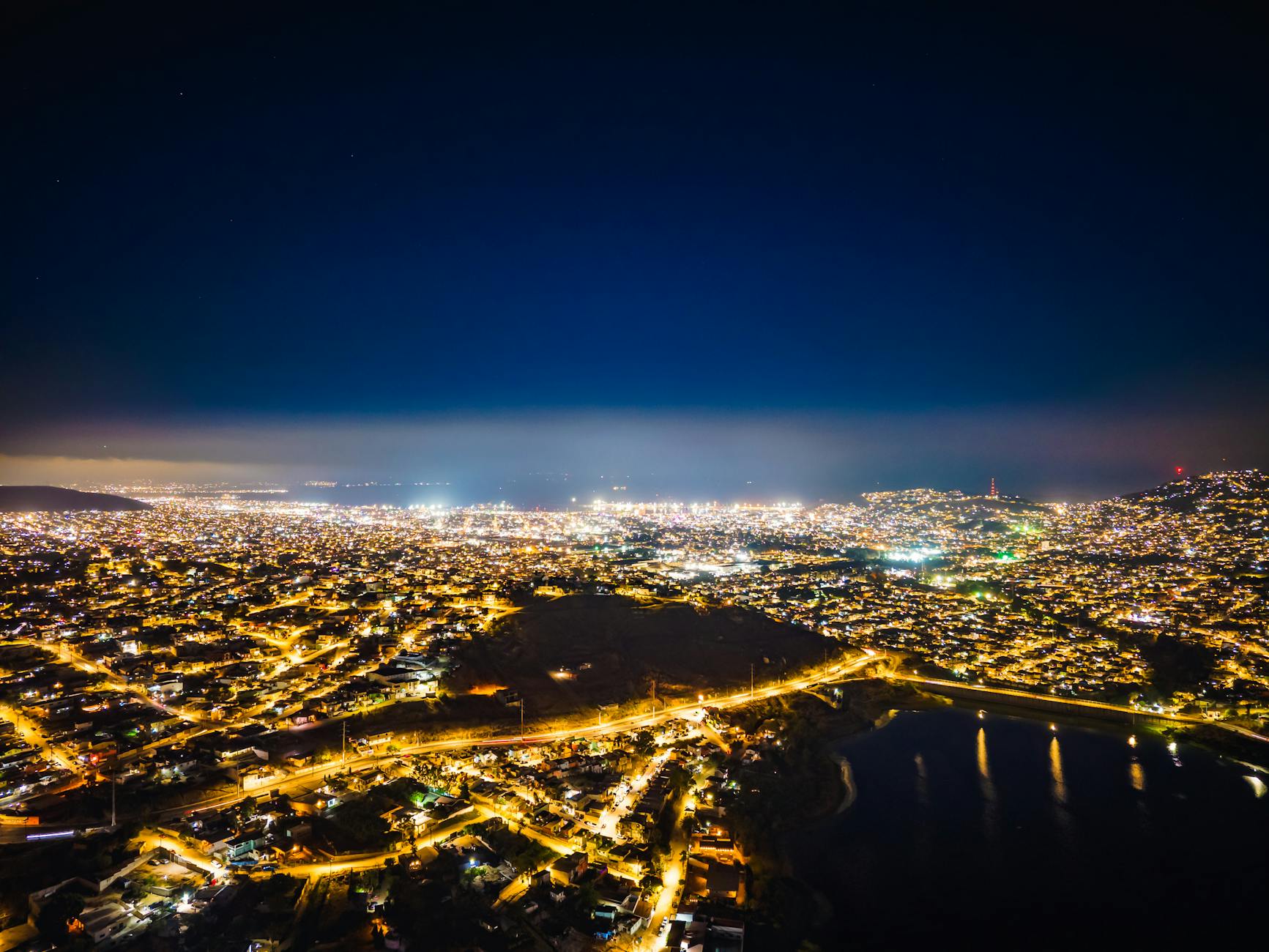 Vibrant city lights illuminating downtown streets at night