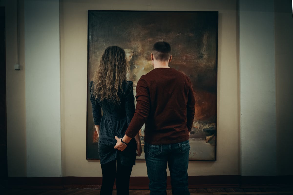 Couple exploring an art gallery together