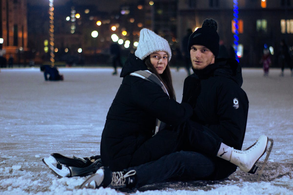 Couple ice skating together in winter