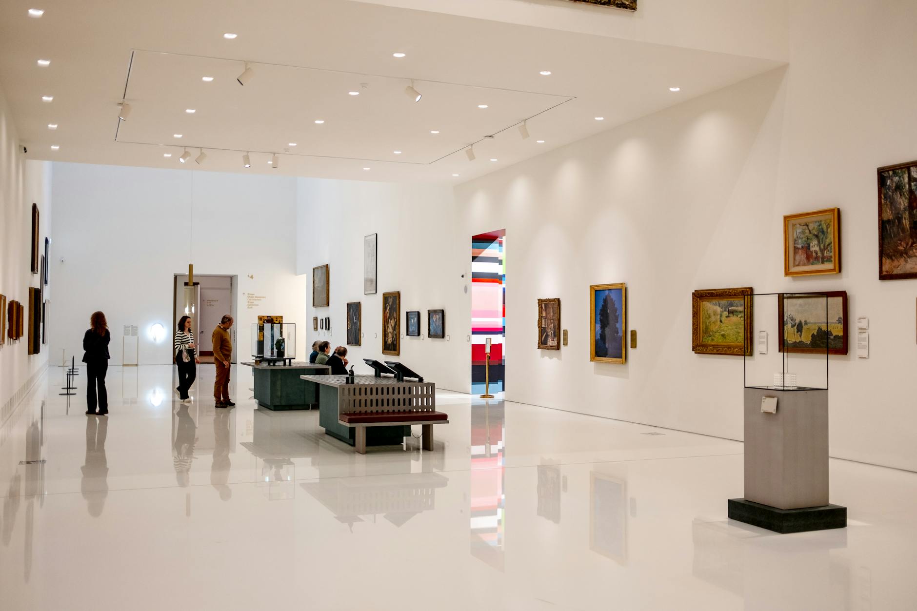 Modern art museum with visitors browsing exhibits