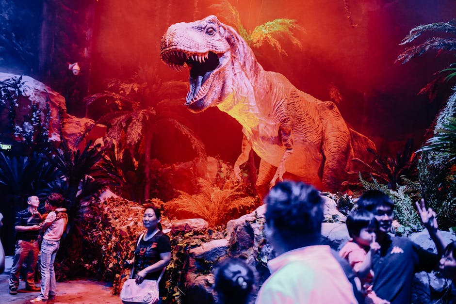 Visitors exploring a lifelike Tyrannosaurus Rex exhibit at a natural history museum