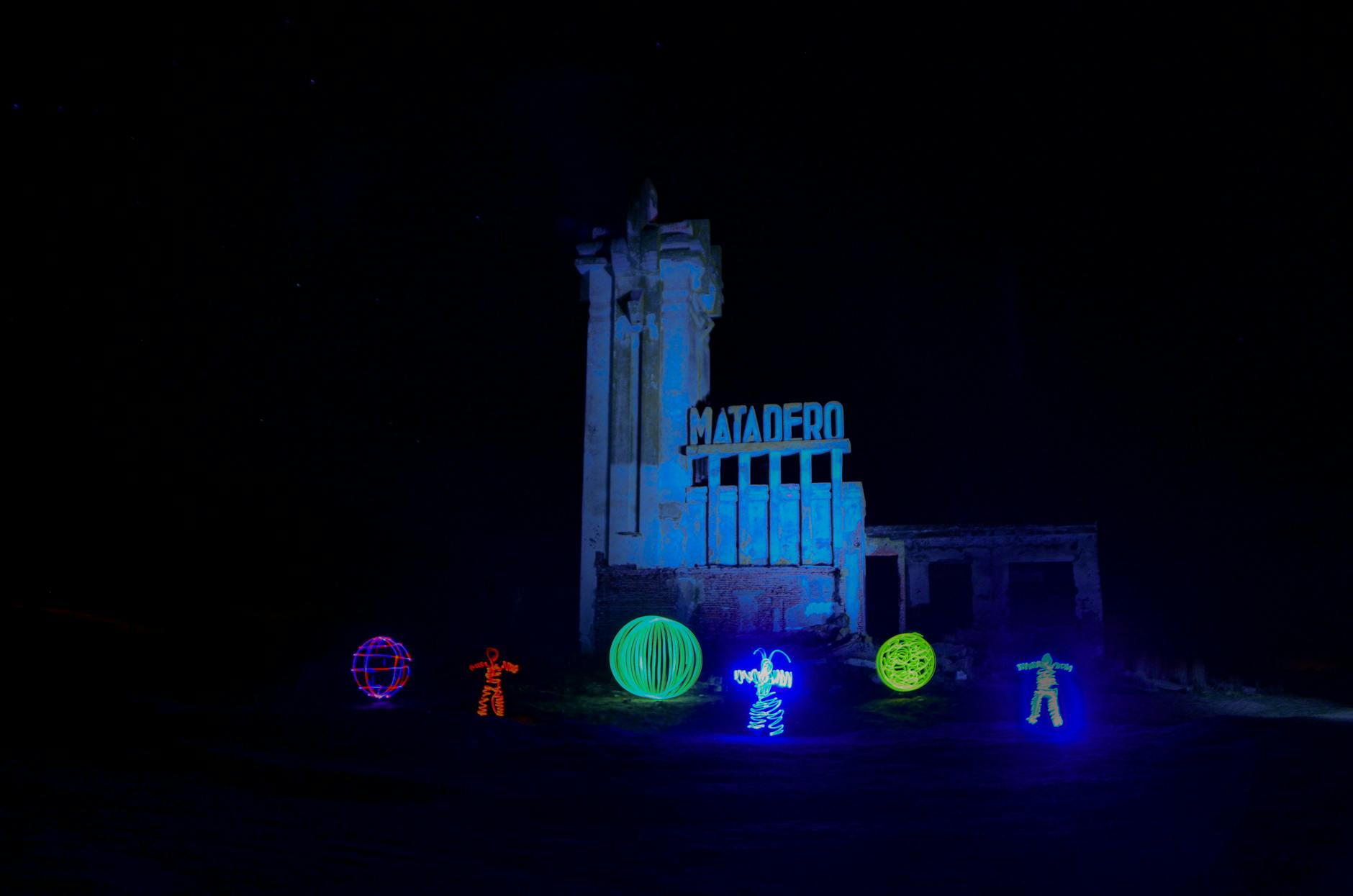 Vibrant light art installation illuminating a building at night