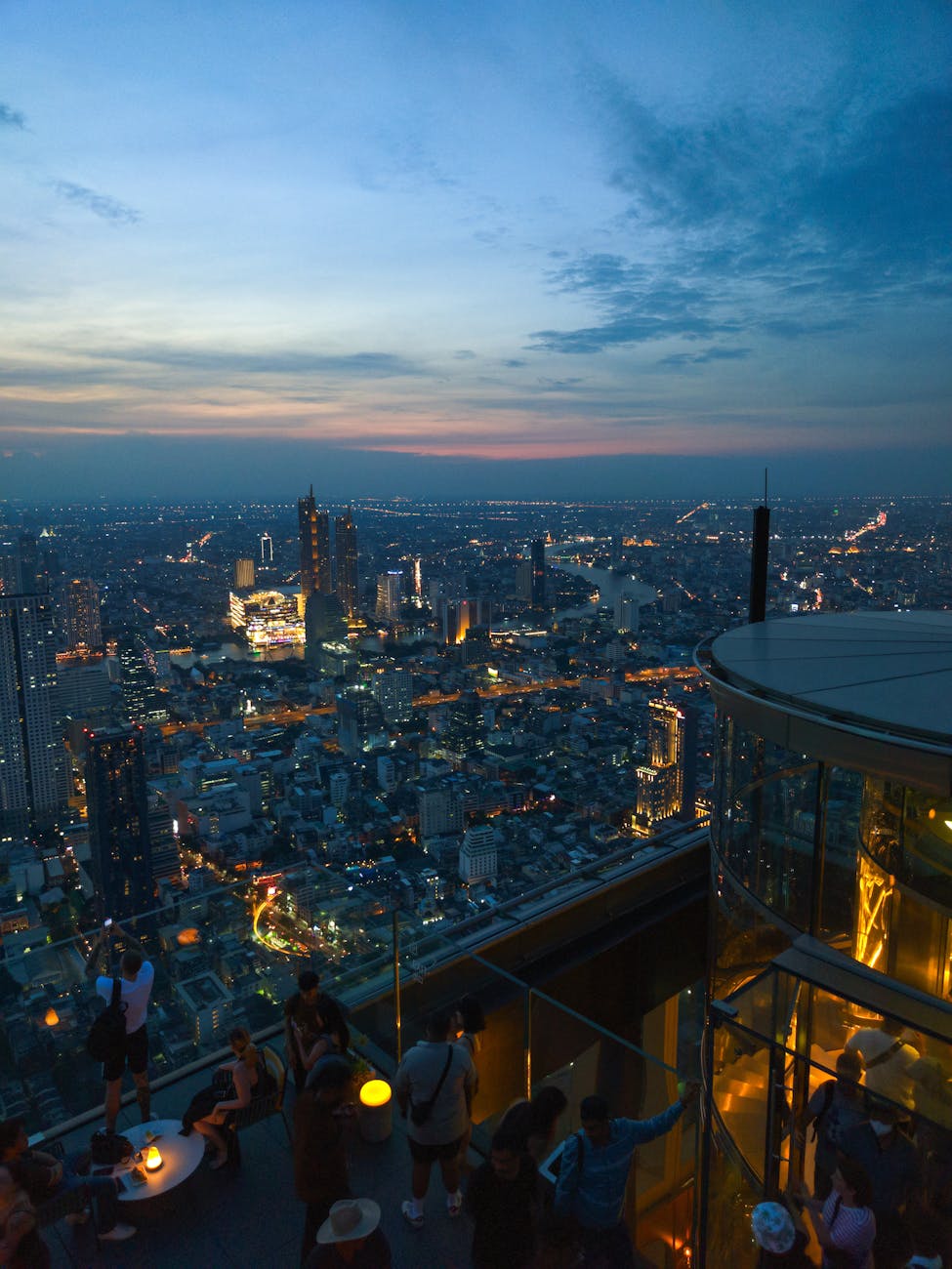 Rooftop bar with panoramic city views at sunset