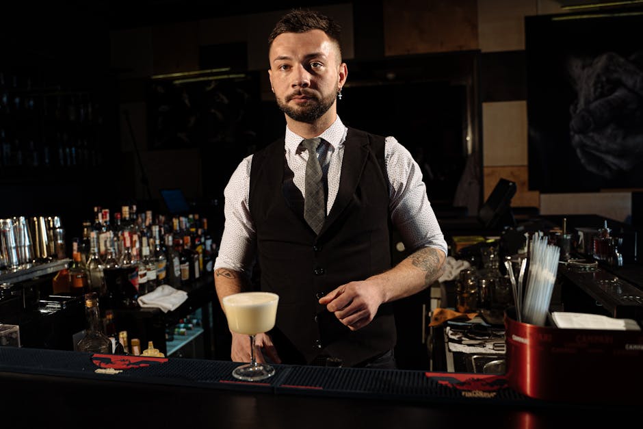 Bartender crafting cocktails at a stylish Toronto nightlife bar
