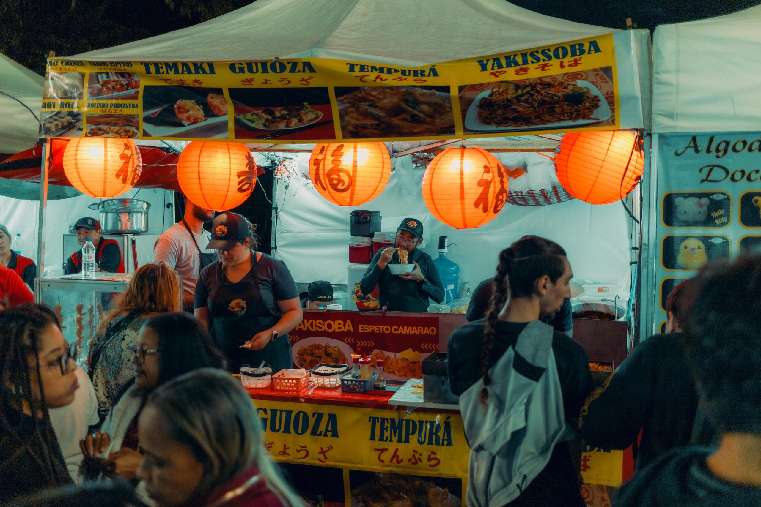 Food festival vendor displaying delicious cuisine at Toronto street food celebration with diverse culinary offerings
