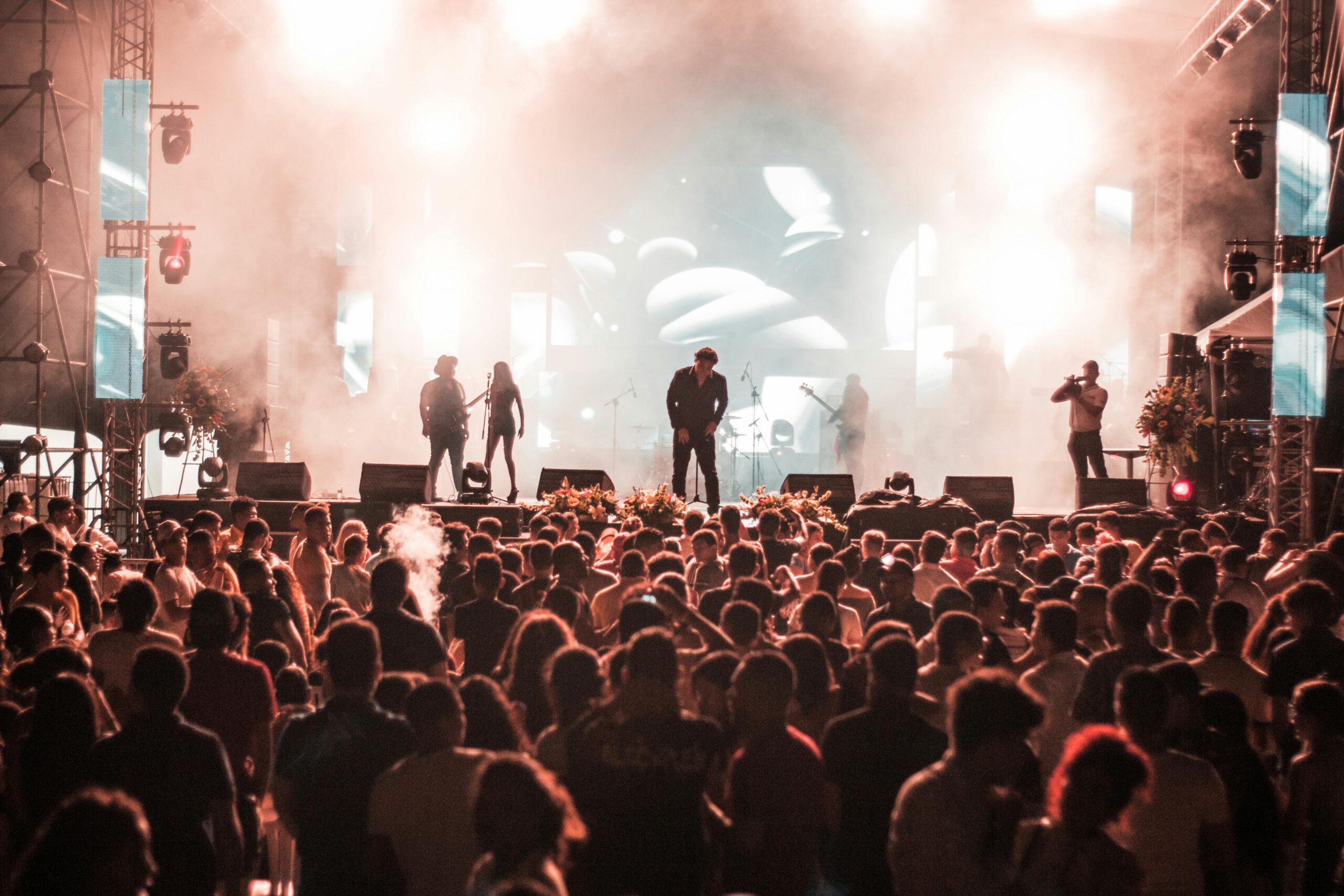 Outdoor concert festival stage at Toronto Jazz Festival with live performers and engaged audience