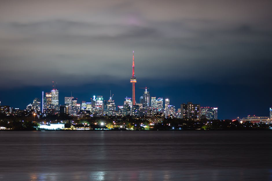 Breathtaking night view of the Toronto cityscape with the CN Tower glowing amidst illuminated skyscrapers