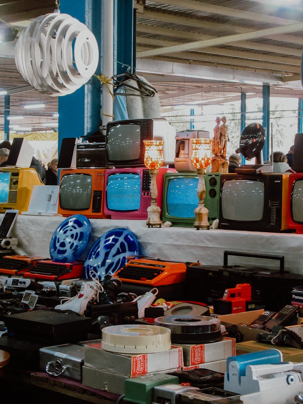 Colorful vintage items displayed at a bustling flea market
