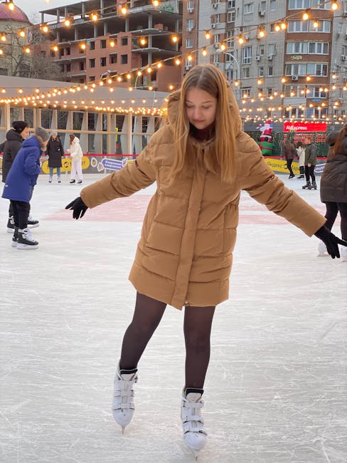 Outdoor ice skating in winter with festive lights — similar to Toronto Nathan Phillips Square rink