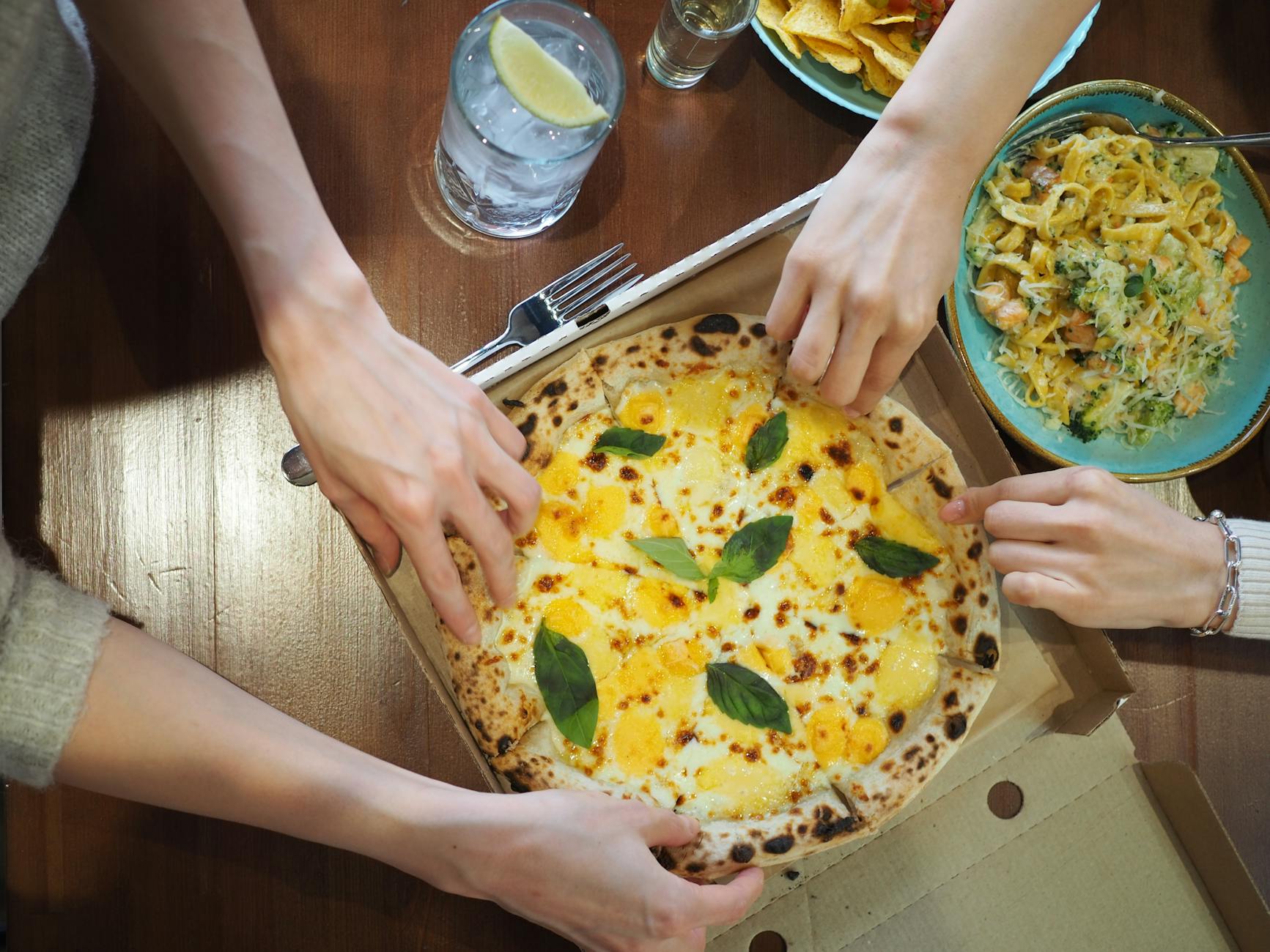 Family restaurants Toronto children eating pizza pasta meal together