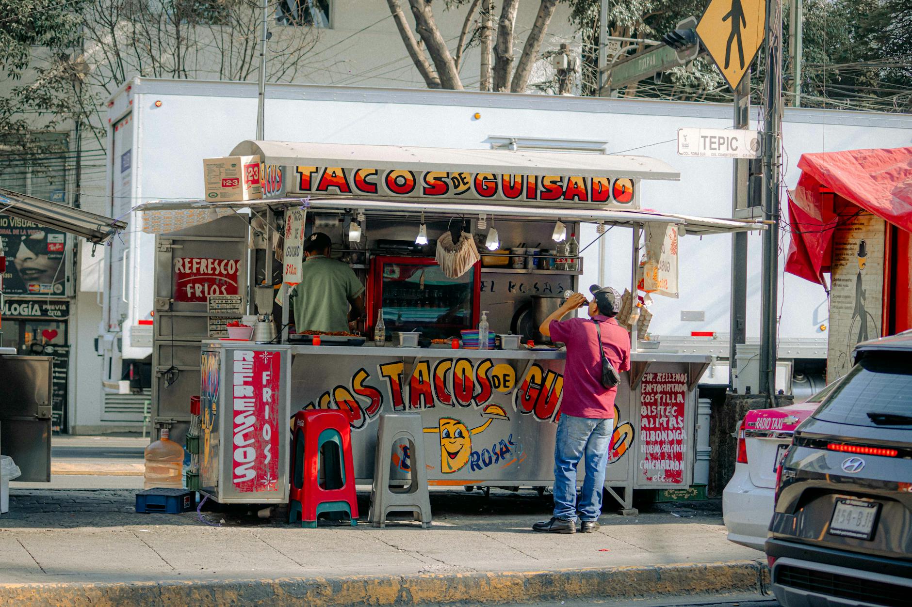 Kensington Market Toronto food vendor with tacos and customers
