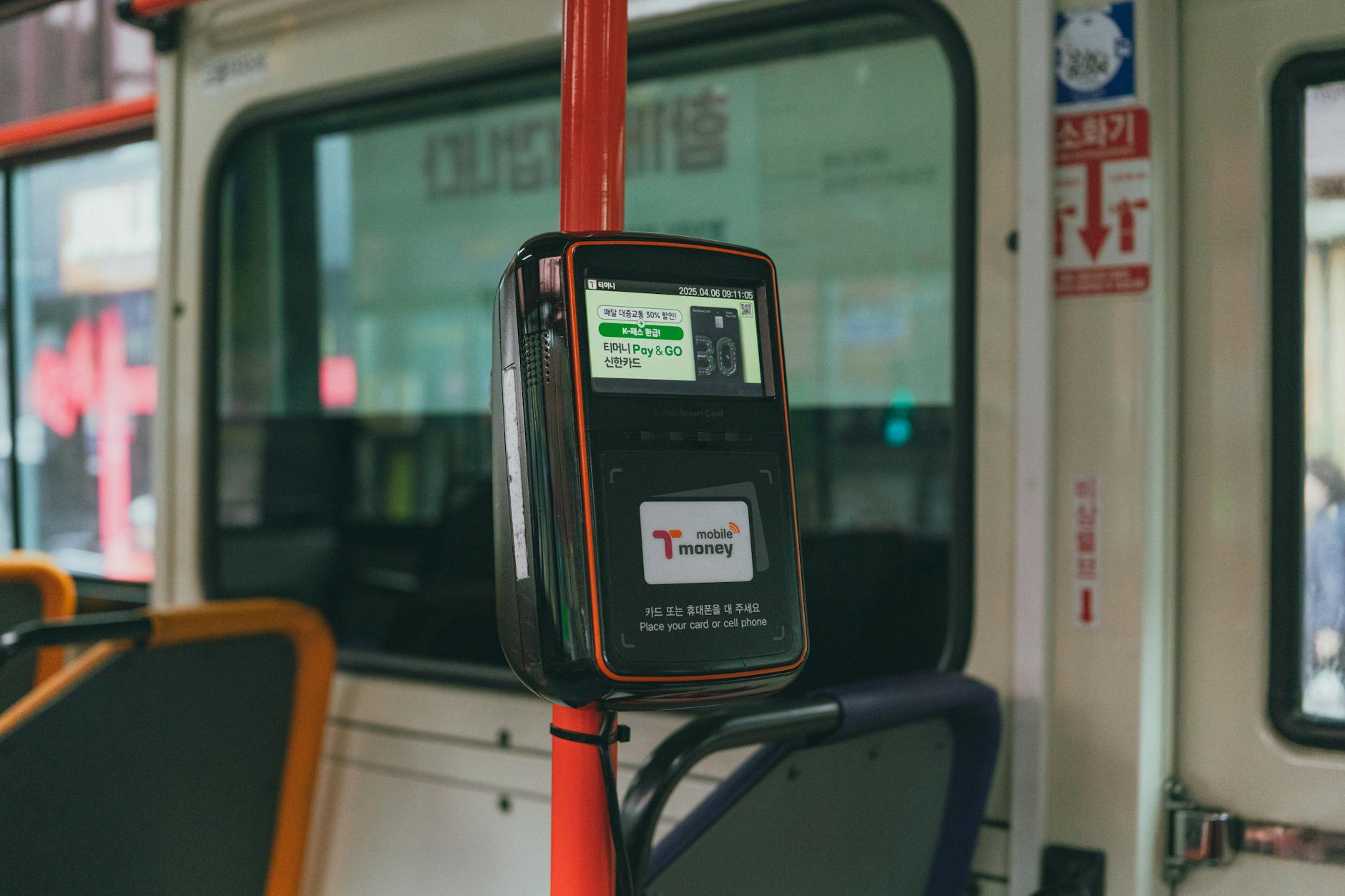 PRESTO card reader on Toronto streetcar with passenger tapping