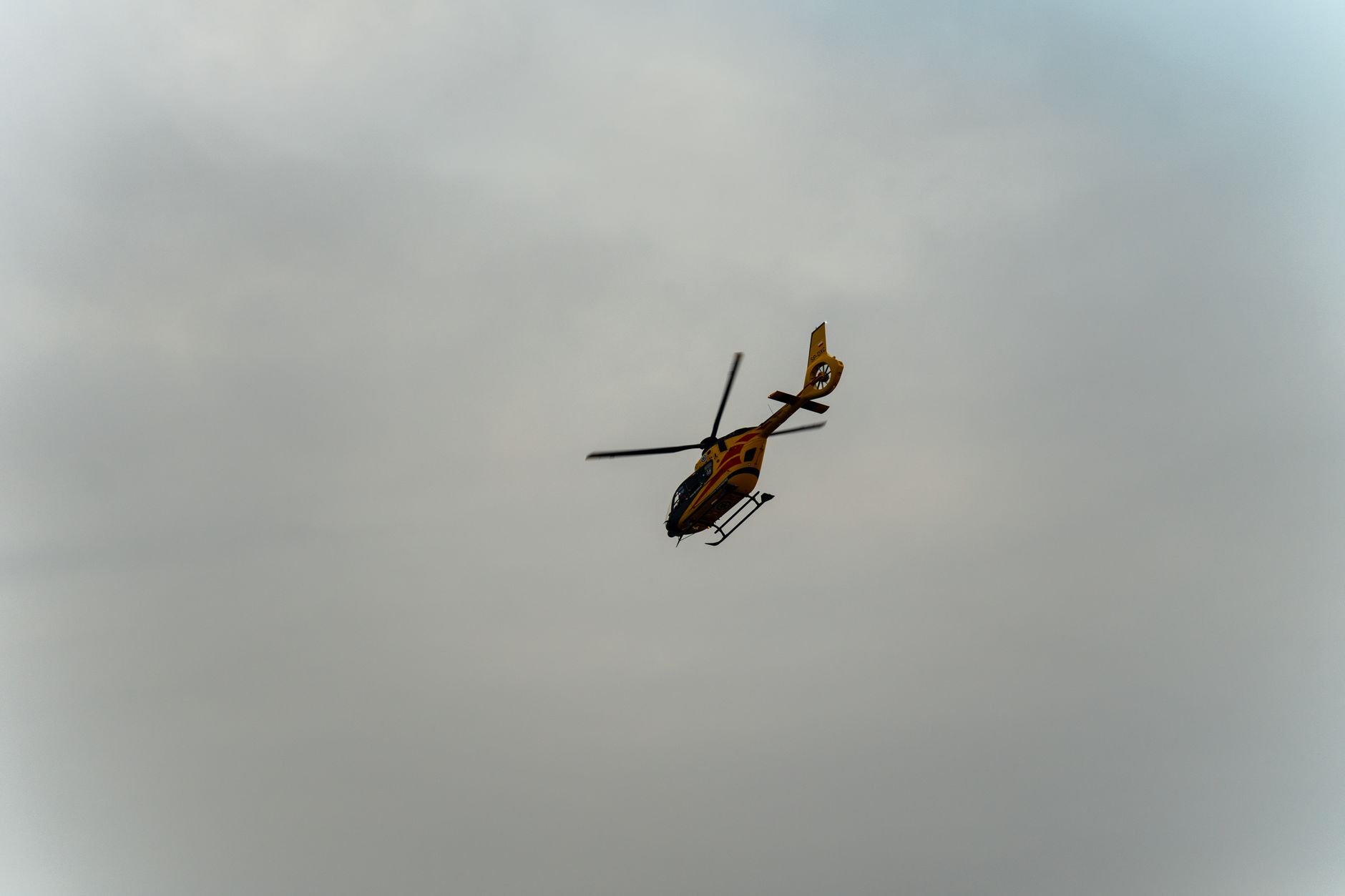 Sightseeing helicopter in flight over a city