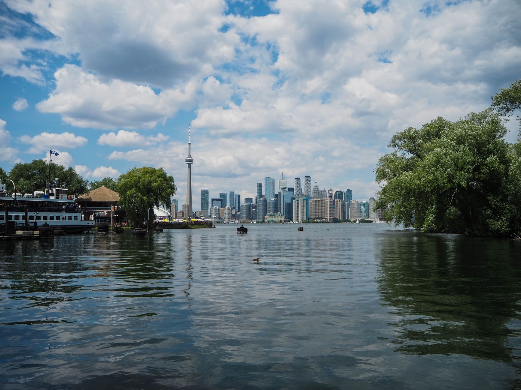 Toronto Islands lagoon looking back at the CN Tower and skyline, a stop on bike and boat Toronto tours