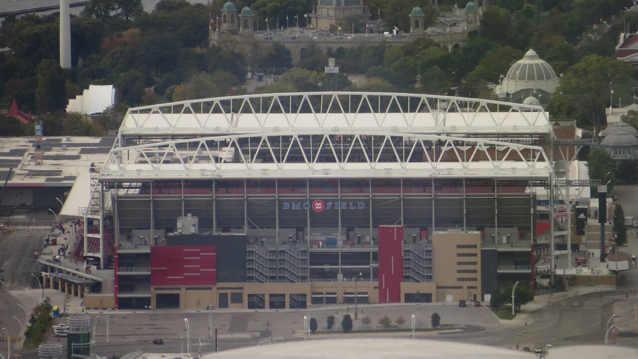 BMO Field stadium seen from above with Exhibition Place and Lake Ontario behind it