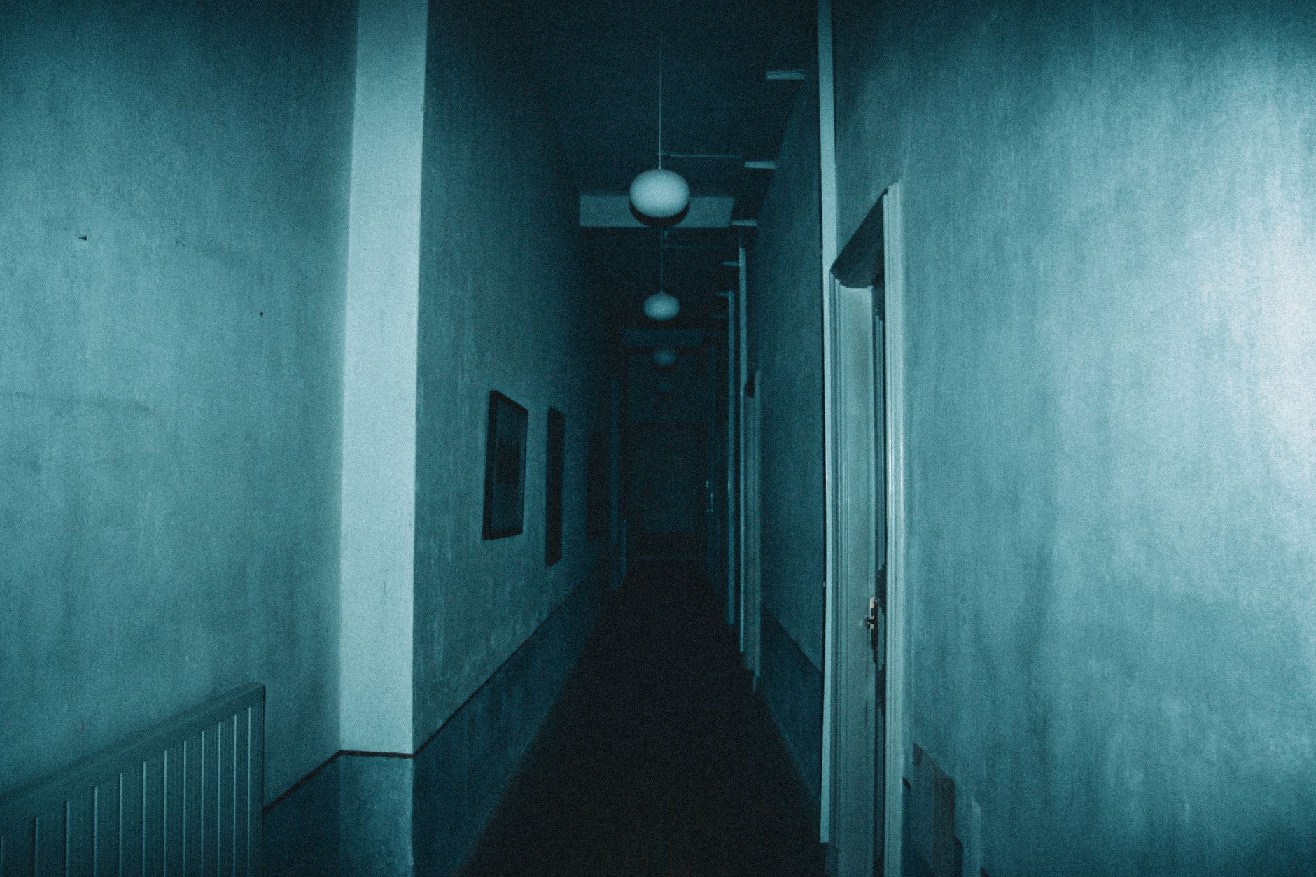 Fog-filled corridor lit in red, the look of a walk-through haunted maze