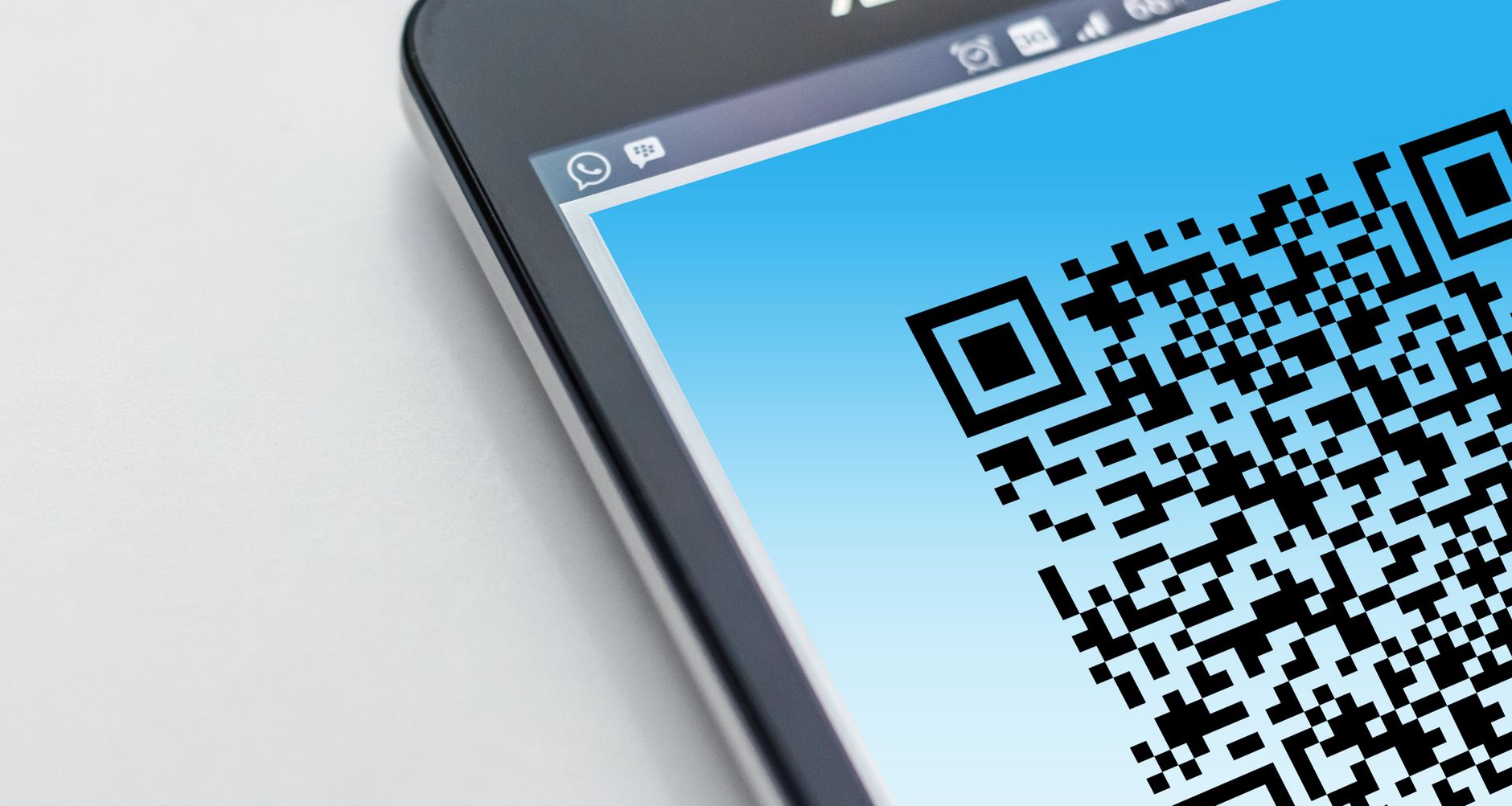 A digital ticket QR code displayed on a phone screen