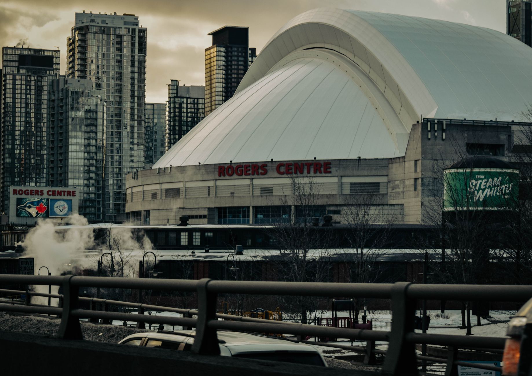 Rogers Centre with its domed roof beside downtown towers, home of the Blue Jays