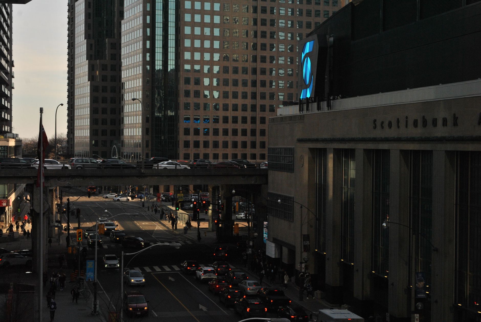Scotiabank Arena on Bay Street at dusk, the home of Toronto sports for the Maple Leafs and Raptors